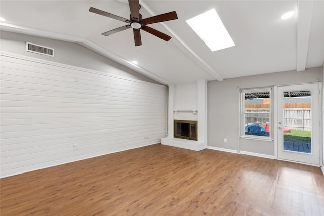 1001 Roaring Springs Dr, Allen, TX 75002 - unfurnished living room with vaulted ceiling, a fireplace, wood finished floors, a ceiling fan, and recessed lighting