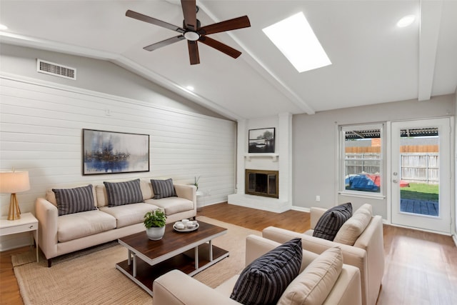 1001 Roaring Springs Dr, Allen, TX 75002 - living area featuring lofted ceiling, wood finished floors, a fireplace, ceiling fan, and recessed lighting