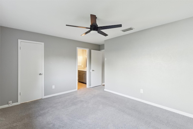 1001 Roaring Springs Dr, Allen, TX 75002 - unfurnished bedroom featuring baseboards, light colored carpet, connected bathroom, and ceiling fan