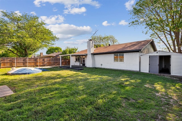 1001 Roaring Springs Dr, Allen, TX 75002 - back of property with a shed, an outdoor structure, a chimney, brick siding, and a swimming pool