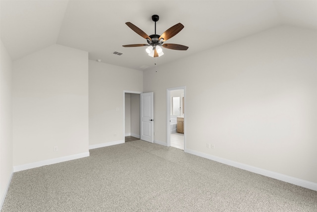 unfurnished bedroom featuring light carpet, visible vents, and lofted ceiling