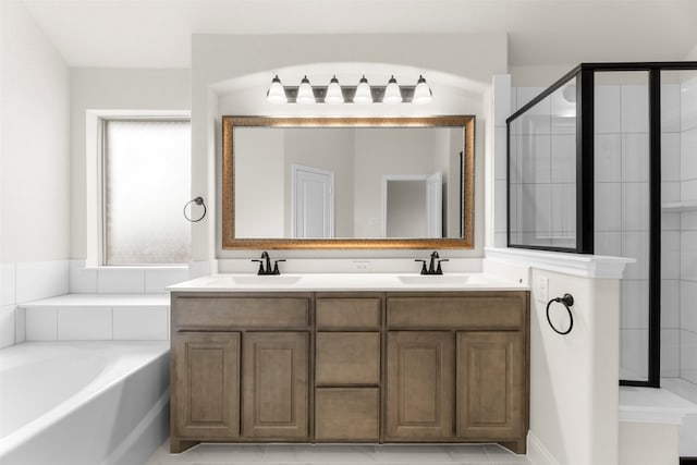 bathroom featuring a sink, a bath, double vanity, and a shower stall