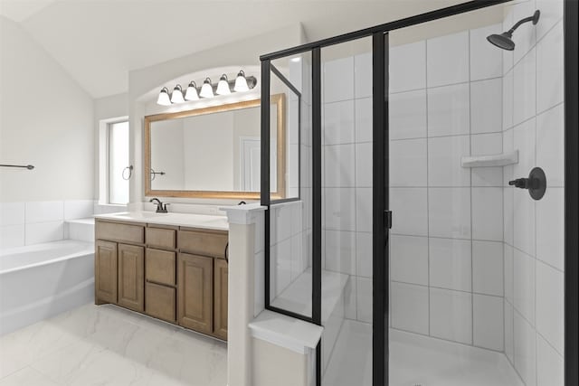 bathroom with a bath, vanity, vaulted ceiling, marble finish floor, and a stall shower