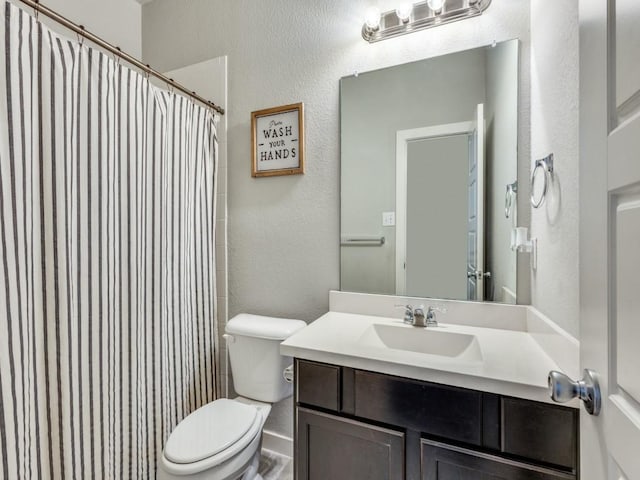 1116 Fulbourne Dr, Anna, TX 75409 - bathroom featuring toilet, a textured wall, vanity, and a shower with shower curtain