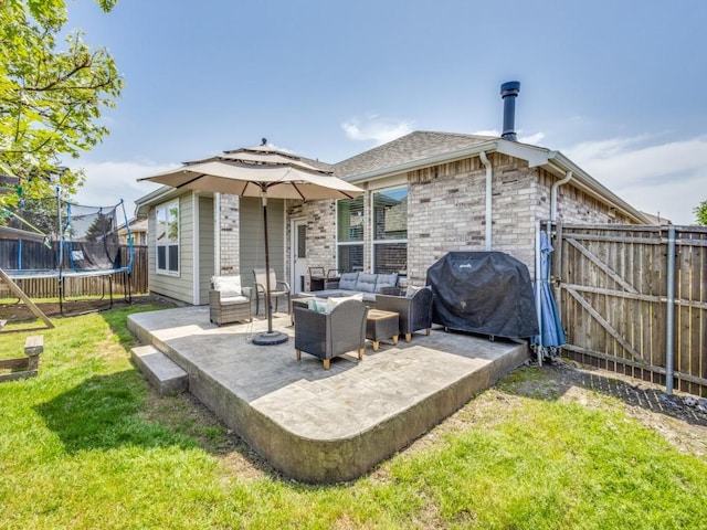 1116 Fulbourne Dr, Anna, TX 75409 - rear view of house with a trampoline, an outdoor hangout area, a patio, and a gate