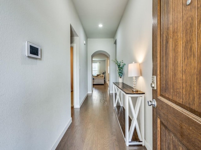 1116 Fulbourne Dr, Anna, TX 75409 - hall with arched walkways, dark wood-type flooring, baseboards, and recessed lighting
