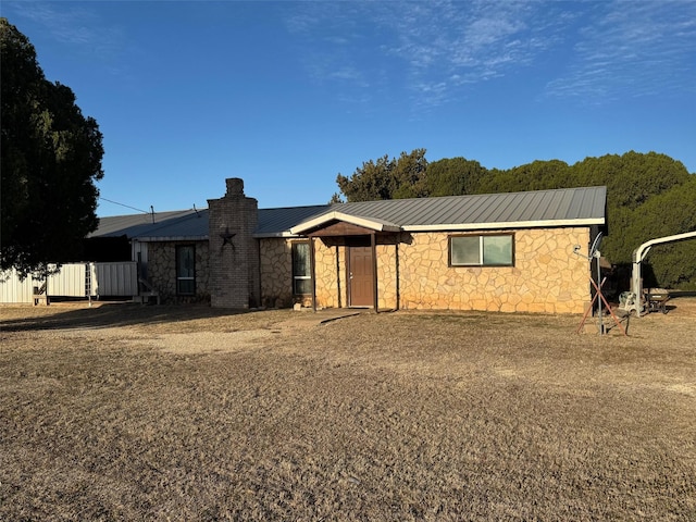 15095 US Highway 82 E, No City, TX 76380 - ranch-style house with stone siding, metal roof, a standing seam roof, and a chimney