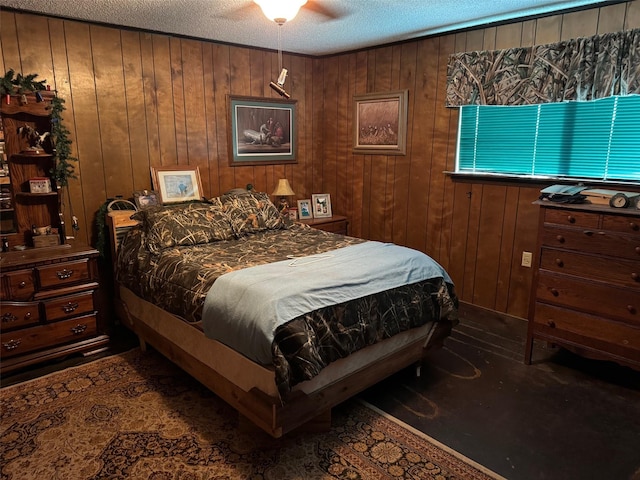 15095 US Highway 82 E, No City, TX 76380 - bedroom featuring wood walls and a textured ceiling
