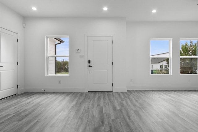 foyer with baseboards, recessed lighting, and wood finished floors