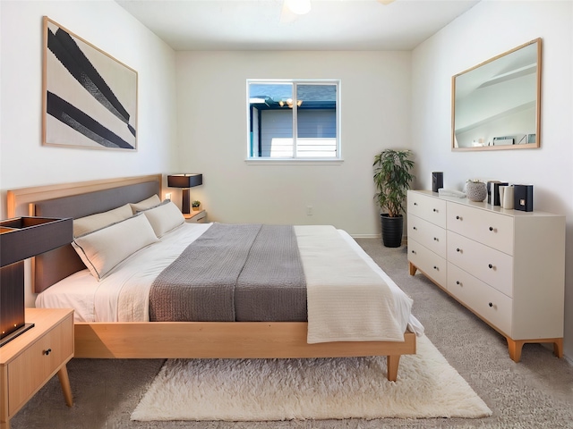 bedroom with light colored carpet