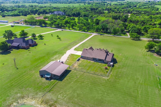 birds eye view of property with a rural view