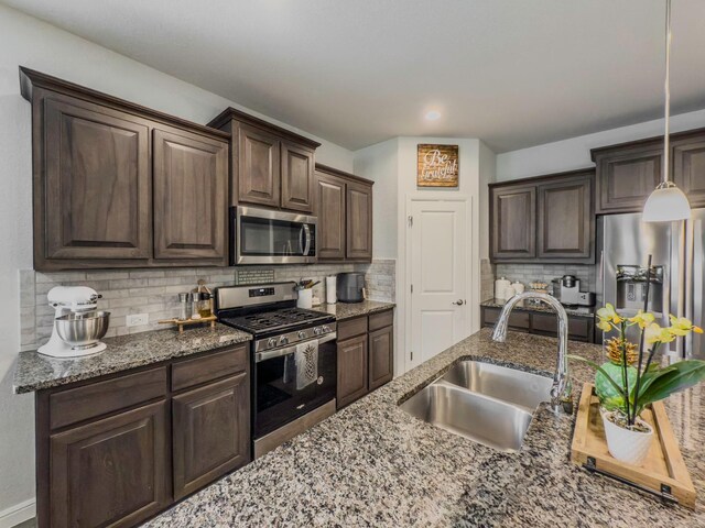 1005 Napier Way, Fort Worth, TX 76247 - living area featuring wood finished floors, a ceiling fan, baseboards, and a decorative wall
