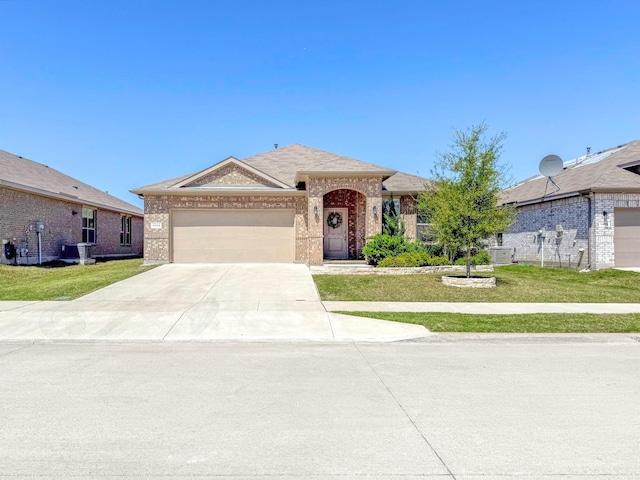 1005 Napier Way, Fort Worth, TX 76247 - single story home with brick siding, a front lawn, driveway, and an attached garage