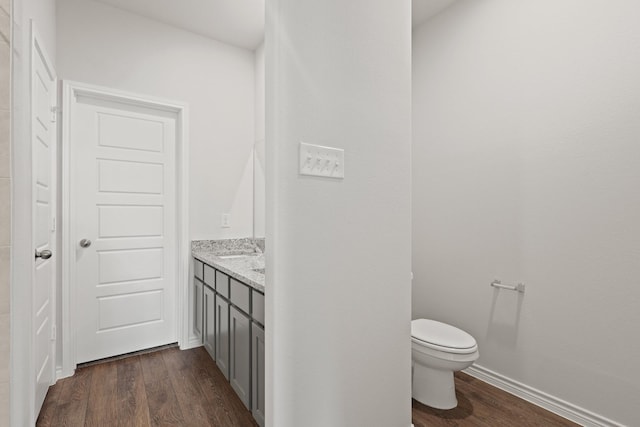 9952 Dynamics Dr, Fort Worth, TX 76131 - bathroom featuring wood finished floors, toilet, and vanity