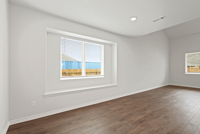 9952 Dynamics Dr, Fort Worth, TX 76131 - empty room with dark wood-style floors, baseboards, recessed lighting, and vaulted ceiling