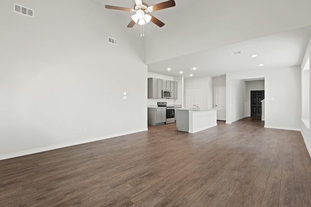 9952 Dynamics Dr, Fort Worth, TX 76131 - unfurnished living room with ceiling fan, dark wood-type flooring, recessed lighting, baseboards, and a sink