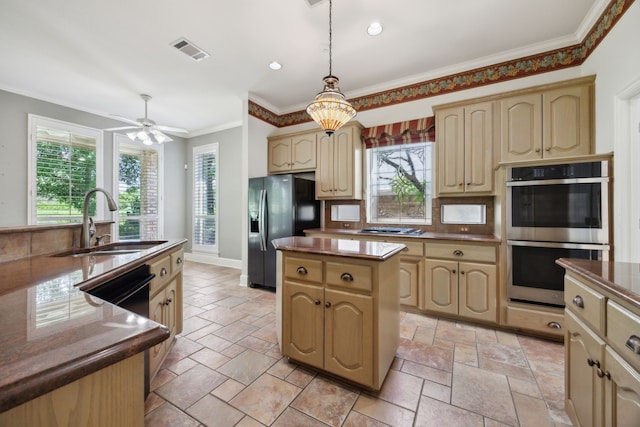 kitchen featuring fridge with ice dispenser, visible vents, a kitchen island, a sink, and stainless steel double oven