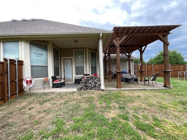 rear view of property with a pergola, a patio area, a shingled roof, and a fenced backyard