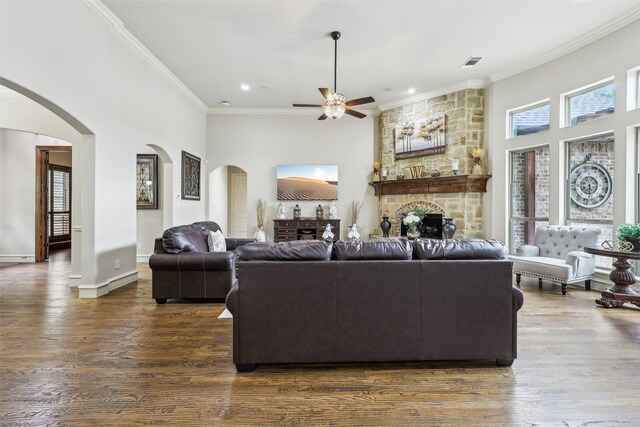 1011 Caribou Dr, Prosper, TX 75078 - kitchen featuring dark stone countertops, arched walkways, tasteful backsplash, high vaulted ceiling, and a kitchen island with sink