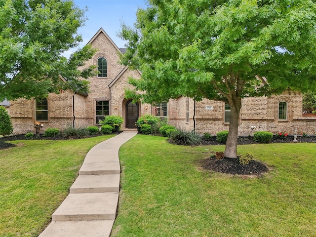 1011 Caribou Dr, Prosper, TX 75078 - view of front facade with brick siding and a front lawn