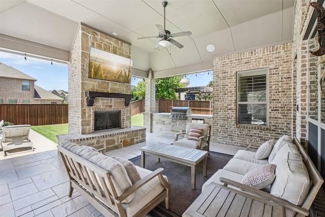 1011 Caribou Dr, Prosper, TX 75078 - fenced backyard featuring an outdoor living space with a fireplace, area for grilling, a patio, and ceiling fan