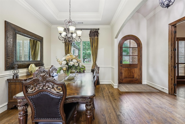 1011 Caribou Dr, Prosper, TX 75078 - dining area featuring a chandelier, healthy amount of natural light, wood finished floors, a tray ceiling, and ornamental molding