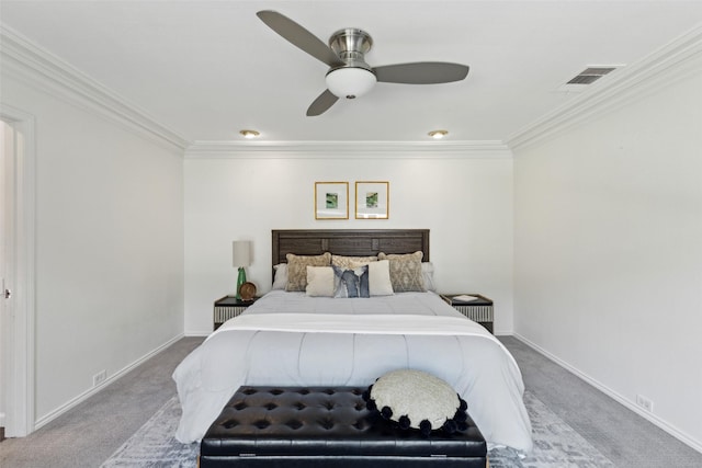 carpeted bedroom with visible vents, baseboards, and ornamental molding
