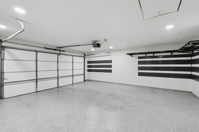 garage with a garage door opener, baseboards, and recessed lighting