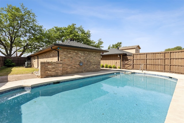 view of swimming pool with a fenced backyard and a fenced in pool