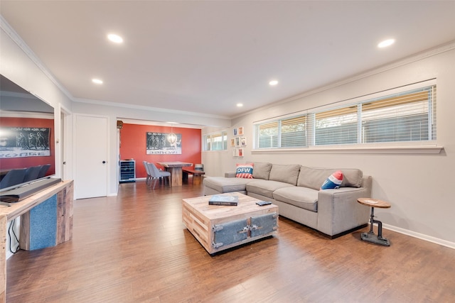 652 Bizerte Ave, Dallas, TX 75224 - living room with wine cooler, recessed lighting, ornamental molding, and wood finished floors