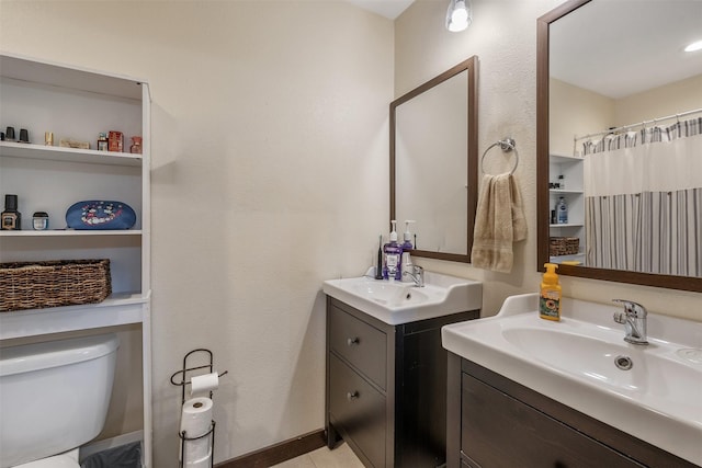 1674 Vz County Road 1514, Grand Saline, TX 75140 - full bathroom with toilet, two vanities, a sink, and tile patterned flooring
