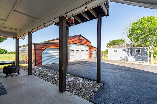 1674 Vz County Road 1514, Grand Saline, TX 75140 - view of patio / terrace with an outbuilding and a garage