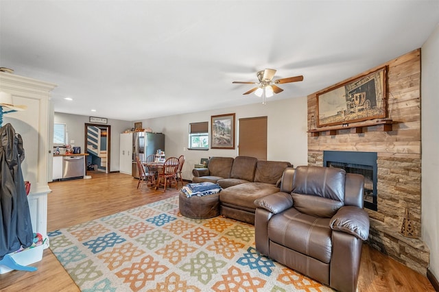1674 Vz County Road 1514, Grand Saline, TX 75140 - living room featuring wood finished floors, ceiling fan, a fireplace, and a healthy amount of sunlight
