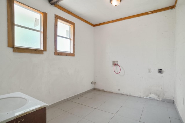 4916 Gooseberry Trl, Granbury, TX 76048 - washroom featuring laundry area, hookup for an electric dryer, a sink, and hookup for a washing machine