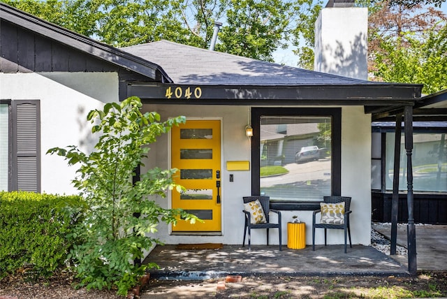 4040 Carolyn Rd, Fort Worth, TX 76109 - entrance to property featuring roof with shingles, a chimney, and stucco siding