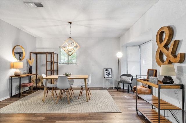 4040 Carolyn Rd, Fort Worth, TX 76109 - dining area with a chandelier, wood finished floors, and baseboards