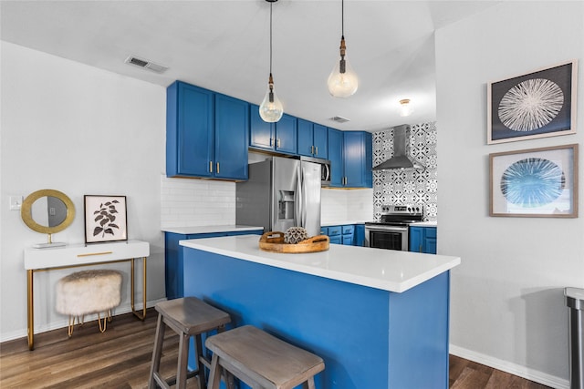 4040 Carolyn Rd, Fort Worth, TX 76109 - kitchen featuring blue cabinetry, stainless steel appliances, wall chimney range hood, light countertops, and dark wood-style floors