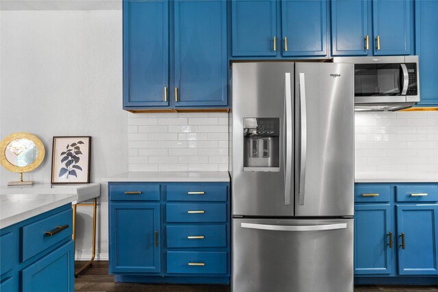 4040 Carolyn Rd, Fort Worth, TX 76109 - kitchen featuring stainless steel appliances, blue cabinets, and tasteful backsplash