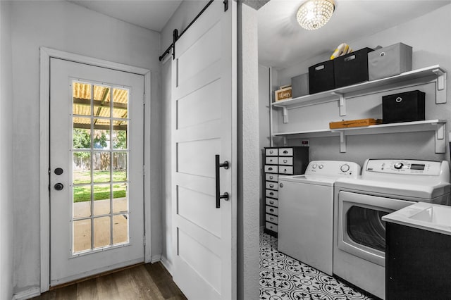 4040 Carolyn Rd, Fort Worth, TX 76109 - laundry area with a barn door, independent washer and dryer, and wood finished floors