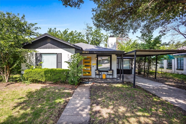 4040 Carolyn Rd, Fort Worth, TX 76109 - view of front of home with a chimney, a carport, and driveway