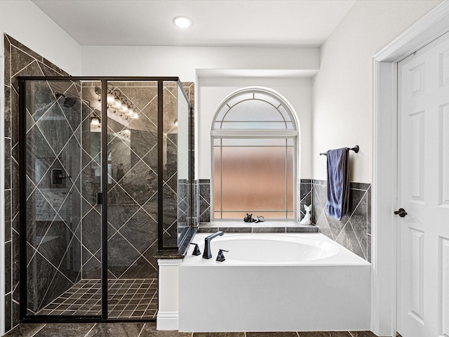 full bath featuring a bath, a stall shower, and recessed lighting