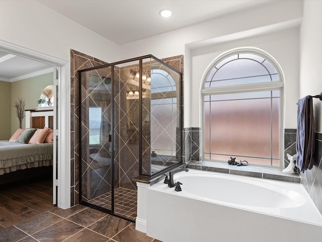ensuite bathroom with crown molding, ensuite bathroom, a shower stall, and a garden tub