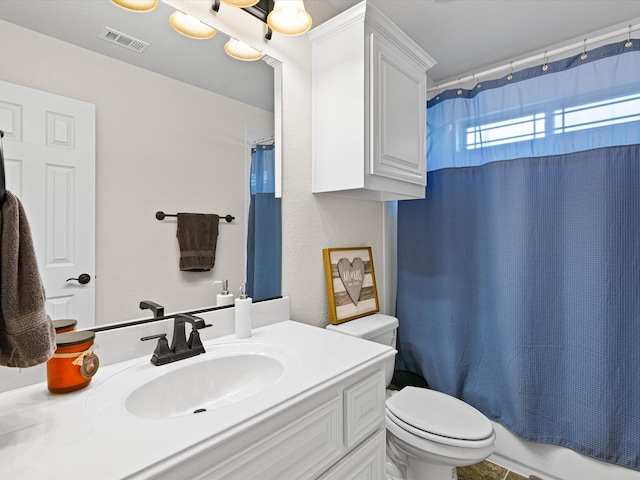full bathroom featuring visible vents, toilet, shower / bathtub combination with curtain, and vanity