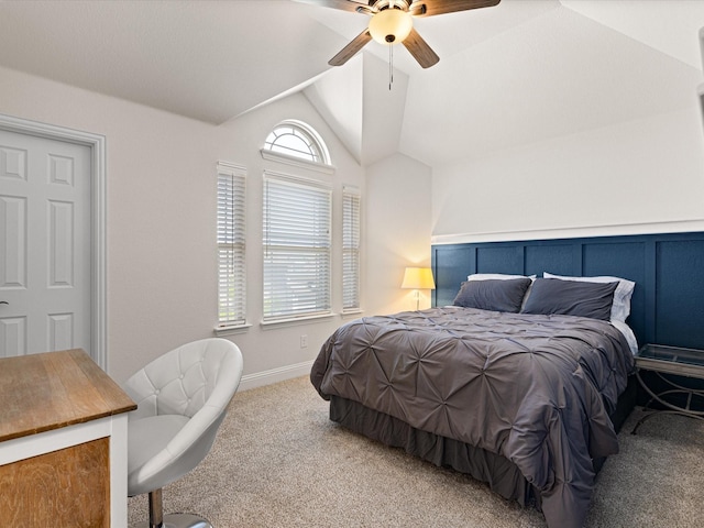 bedroom featuring carpet, baseboards, a ceiling fan, and lofted ceiling