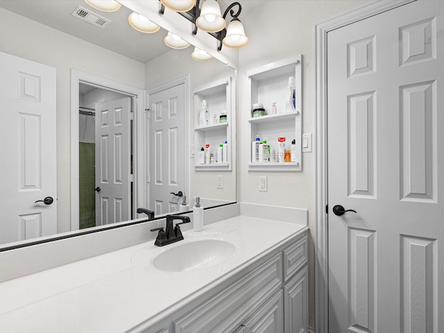 bathroom featuring a notable chandelier, vanity, visible vents, and a shower with curtain