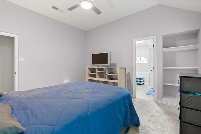 bedroom with ceiling fan, visible vents, vaulted ceiling, baseboards, and carpet
