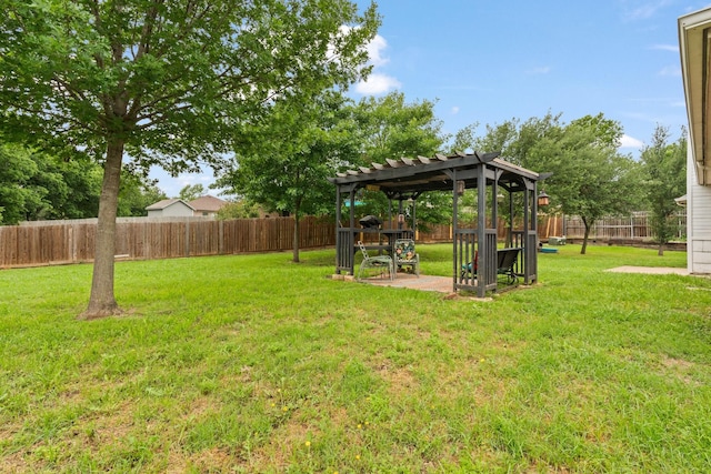 view of yard featuring a pergola and a fenced backyard