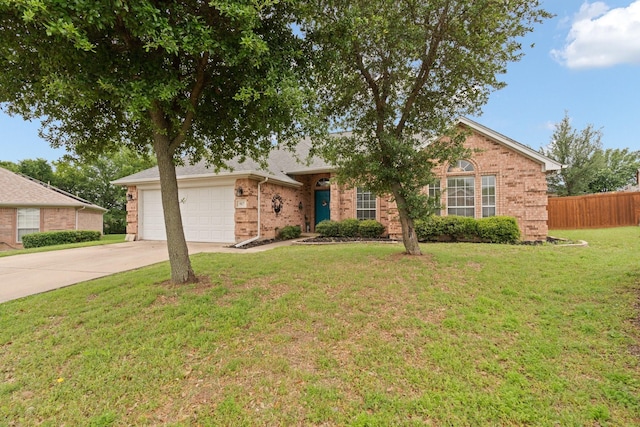 ranch-style house featuring a front lawn, fence, brick siding, concrete driveway, and an attached garage