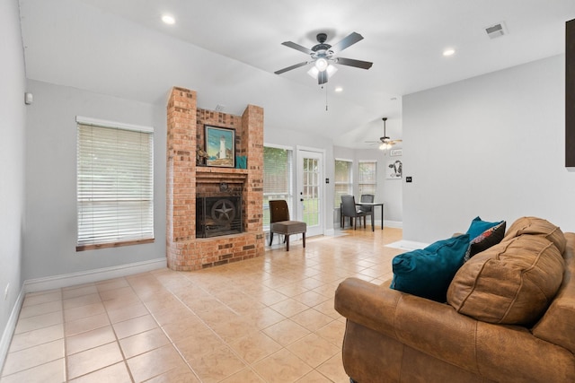 living room featuring light tile patterned flooring, a brick fireplace, a ceiling fan, baseboards, and lofted ceiling