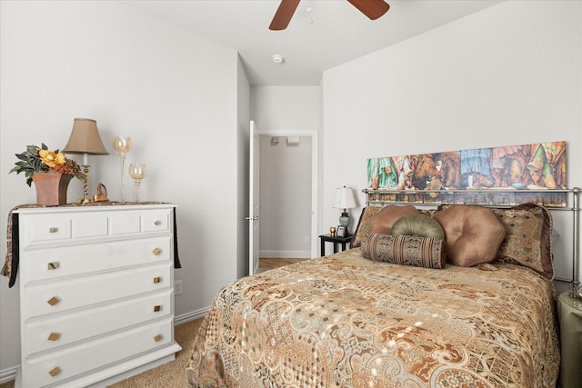 carpeted bedroom with baseboards and a ceiling fan